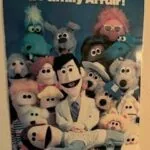 Vintage chiropractic care poster featuring colorful puppet characters with text reading 'Chiropractic Care is a Family Affair'